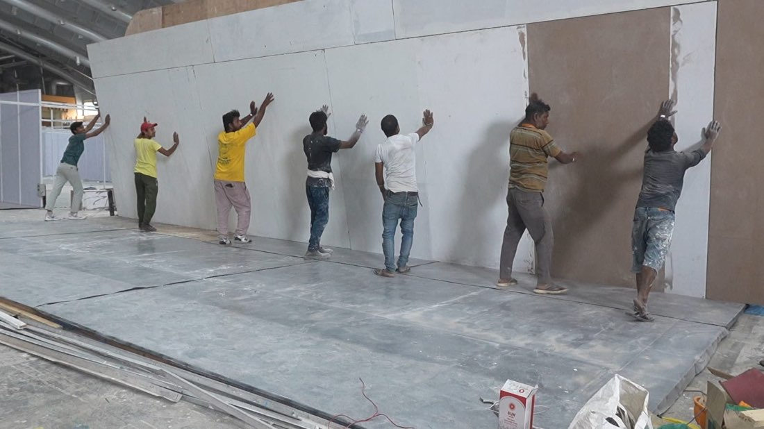Crew raising a finished wall panel
