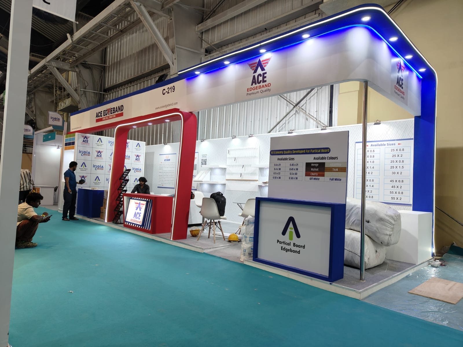 ACE Edgeband stall with red portal frame, blue lit fascia and sample wall