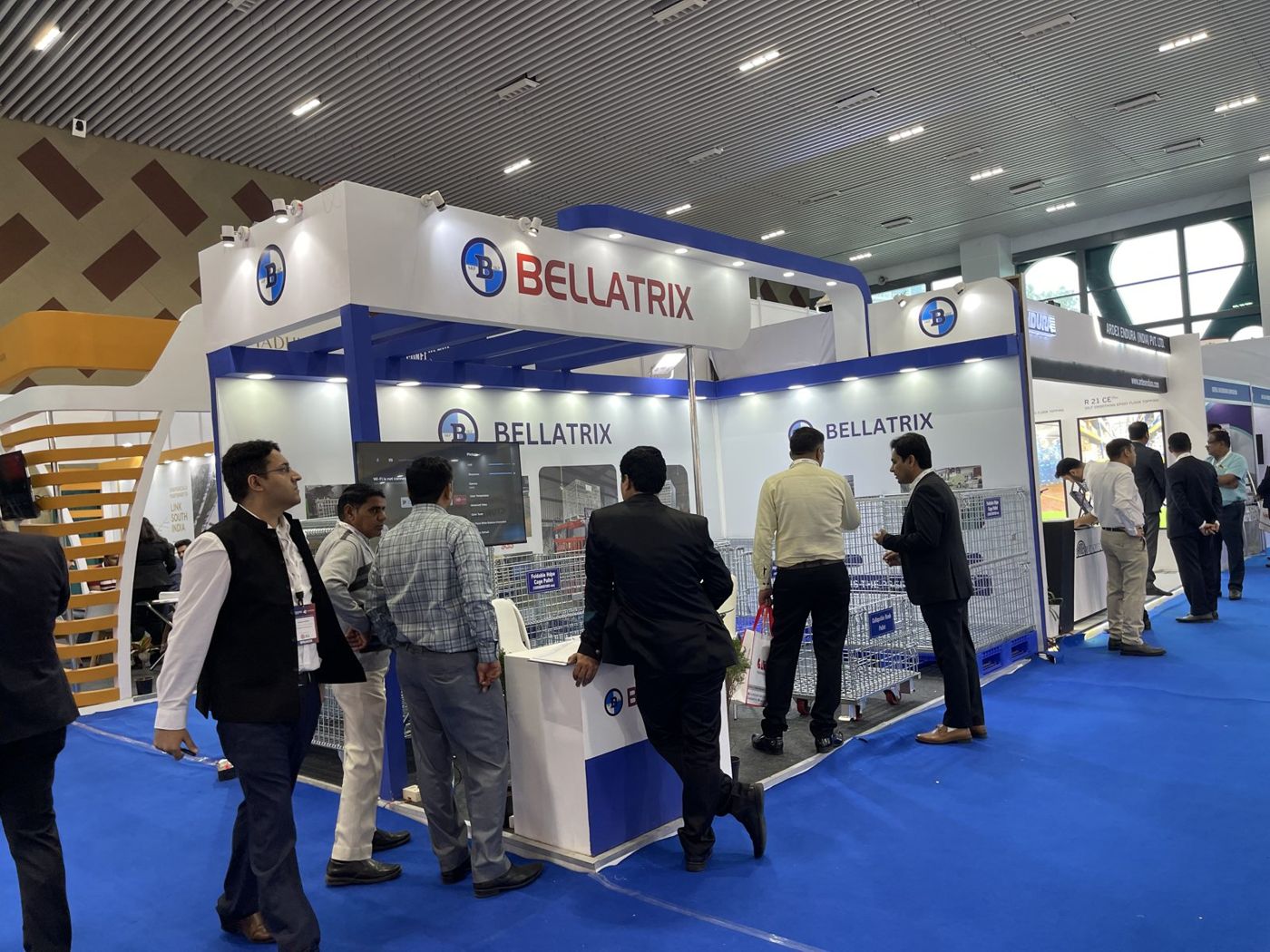 Bellatrix stall with white fascia, red lettering, blue beams and cage pallets on display