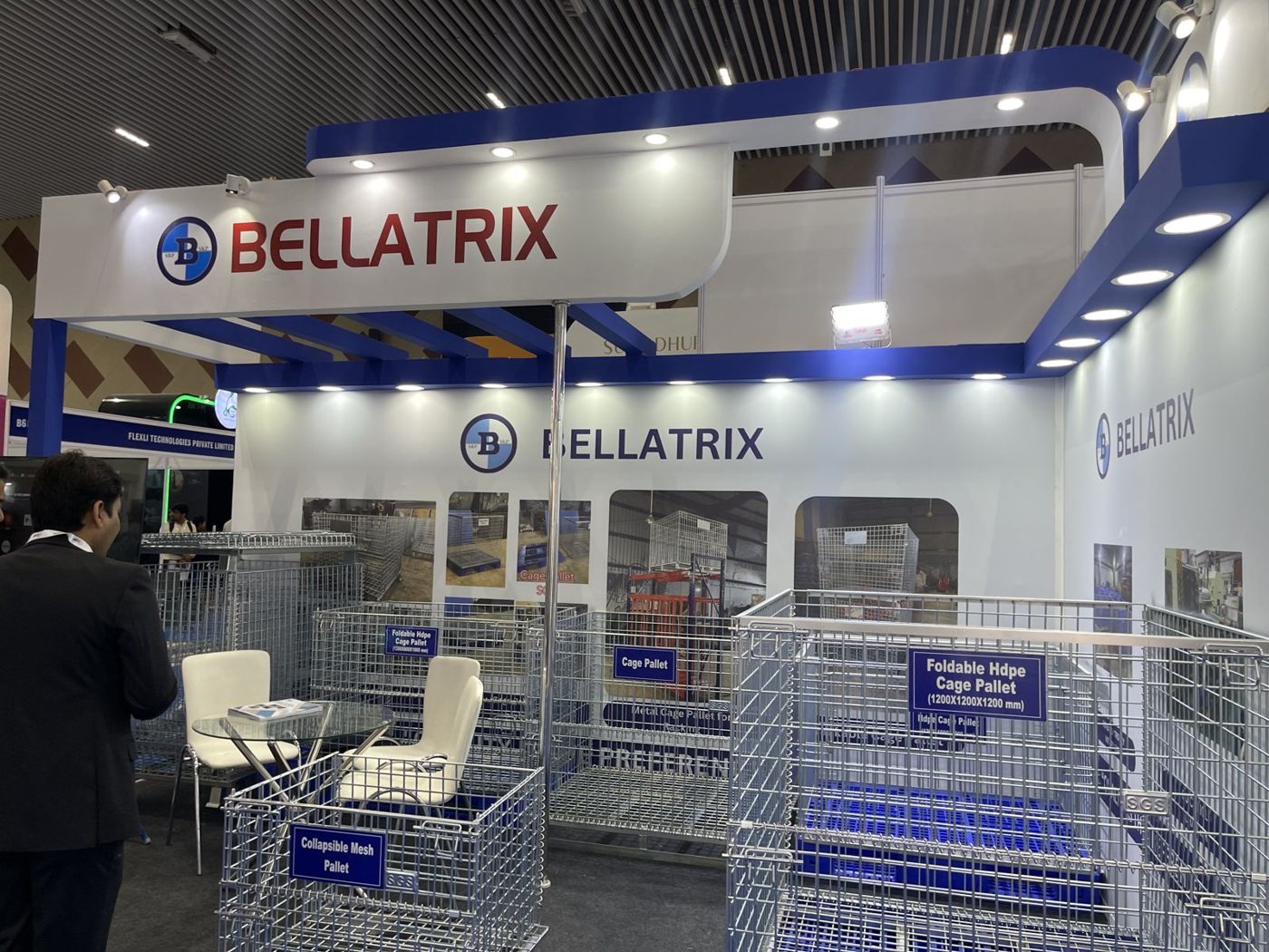 Bellatrix cage pallets and collapsible mesh pallets with blue product signs under the curved fascia