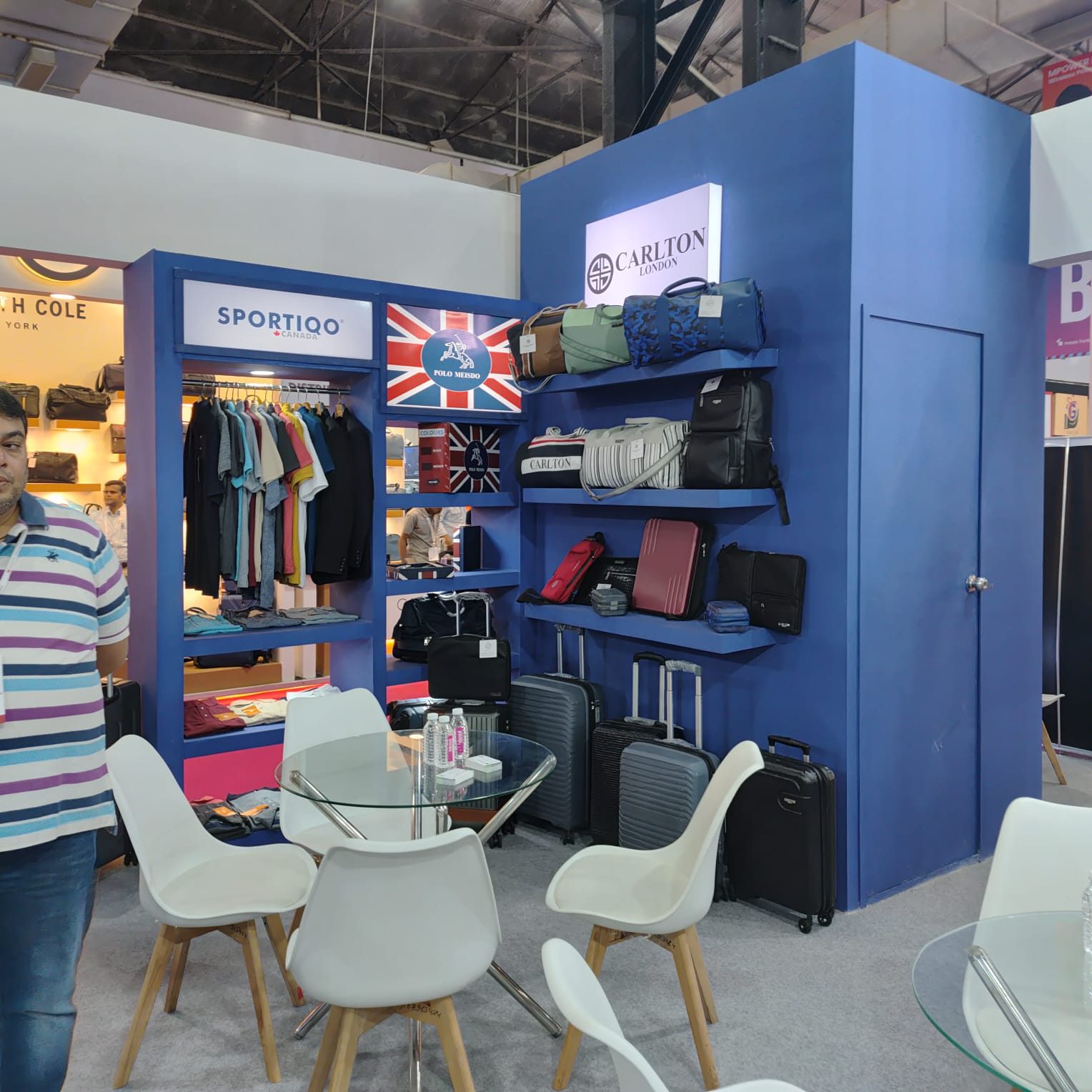Carlton London and Sportiqo blue stall with bag shelving, apparel rail and glass table