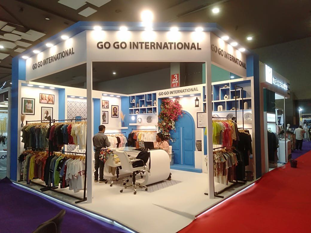 Go Go International stall with blue corner columns, arched door feature and lit fascia