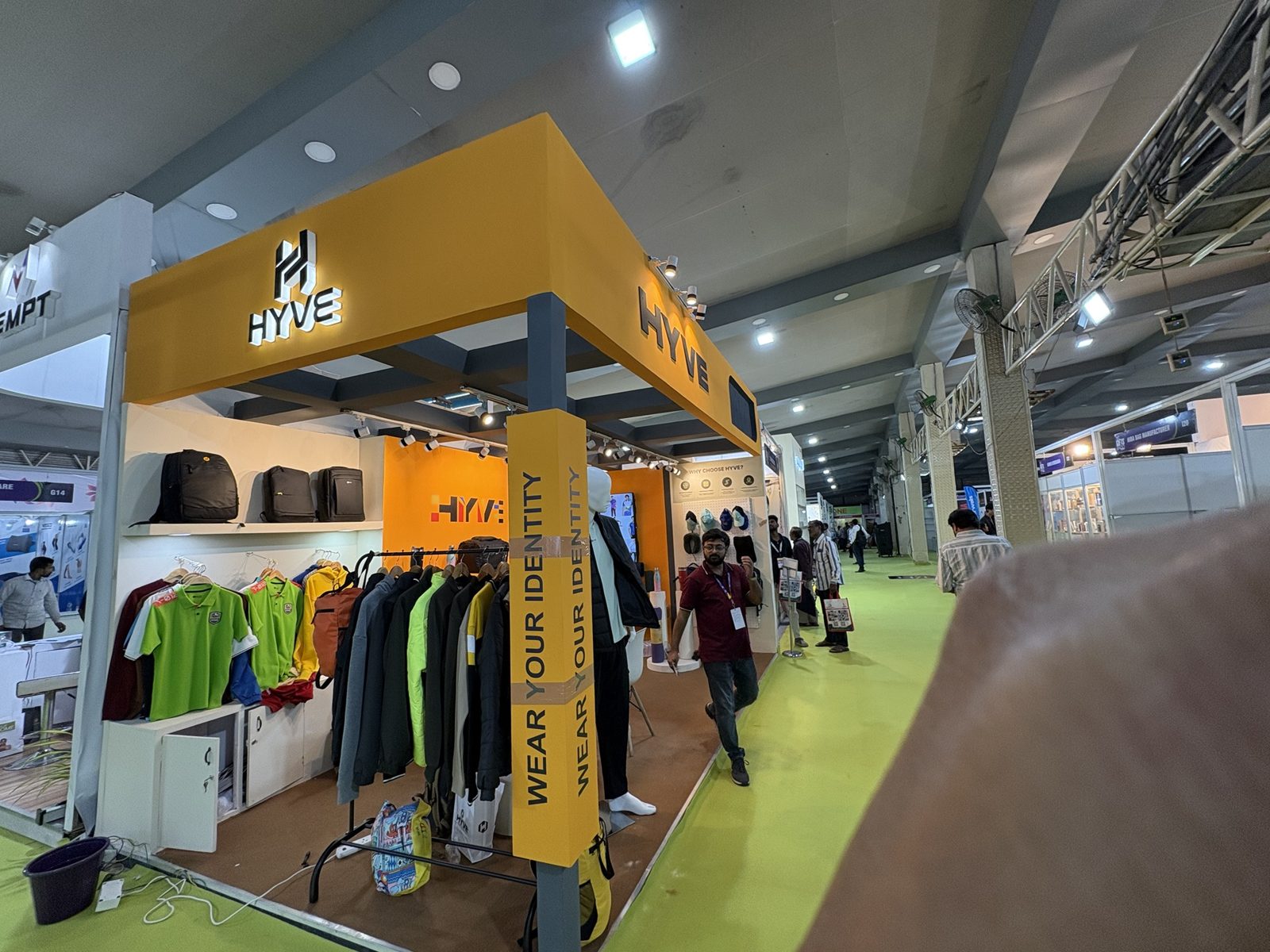 Hyve stall front with the Wear Your Identity column, mannequin and pegboard wall