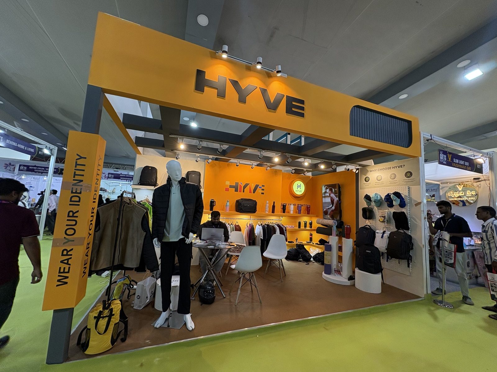 Hyve backlit logo on the orange fascia with clothing rails below