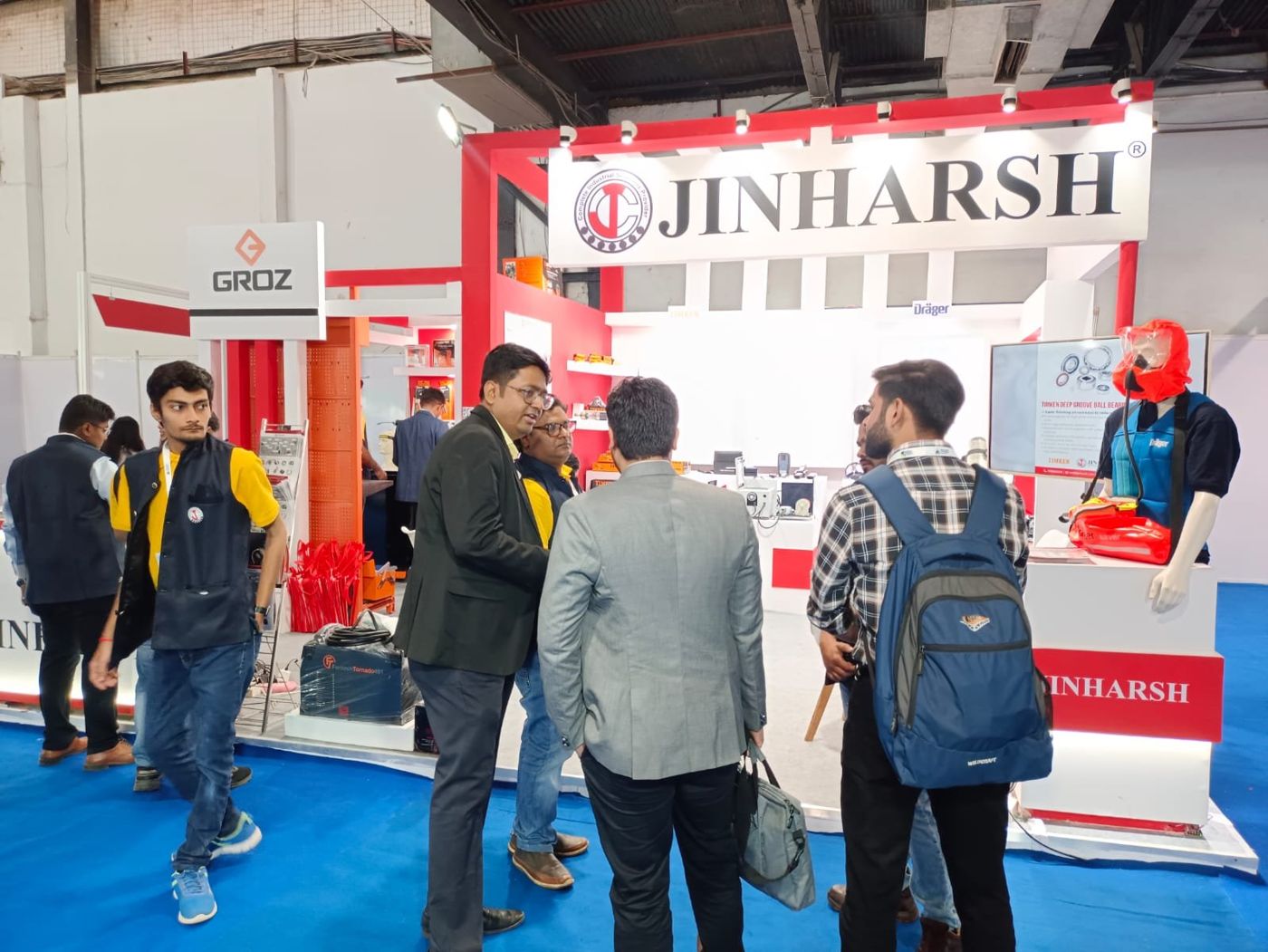 Jinharsh stall during the show with visitors at the front, the Groz section and a mannequin in safety gear