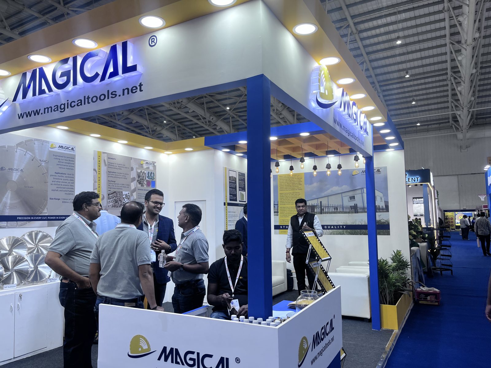 Magical corner stall with backlit fascia and visitors at the counter
