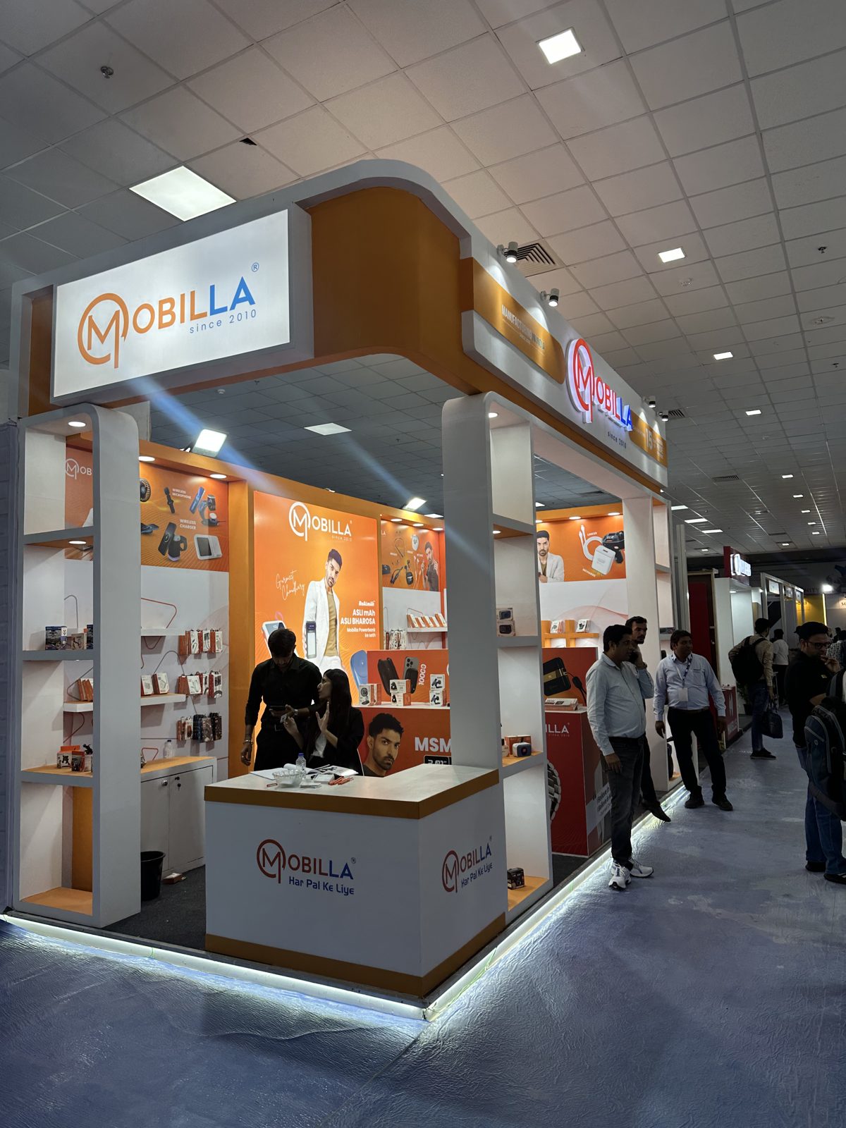 Side view of the Mobilla stall with backlit logo and shelving