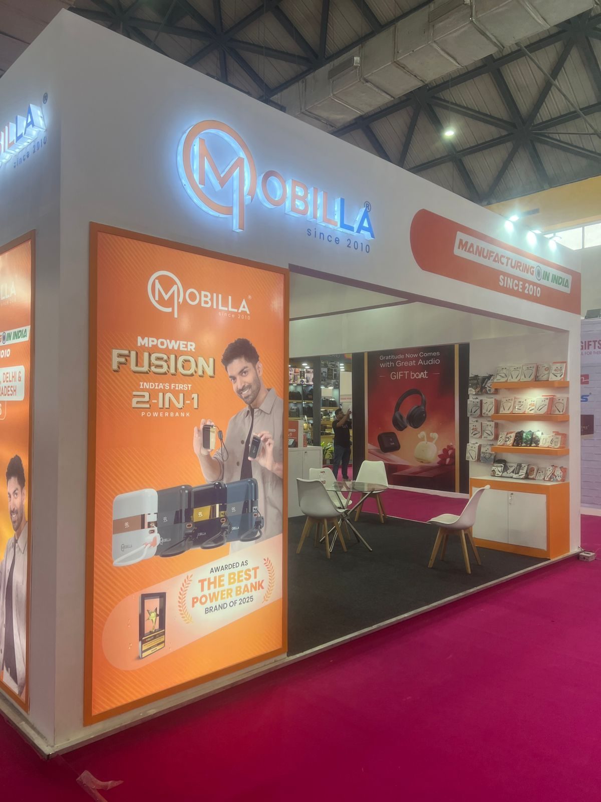Mobilla stall wall with a large product launch graphic