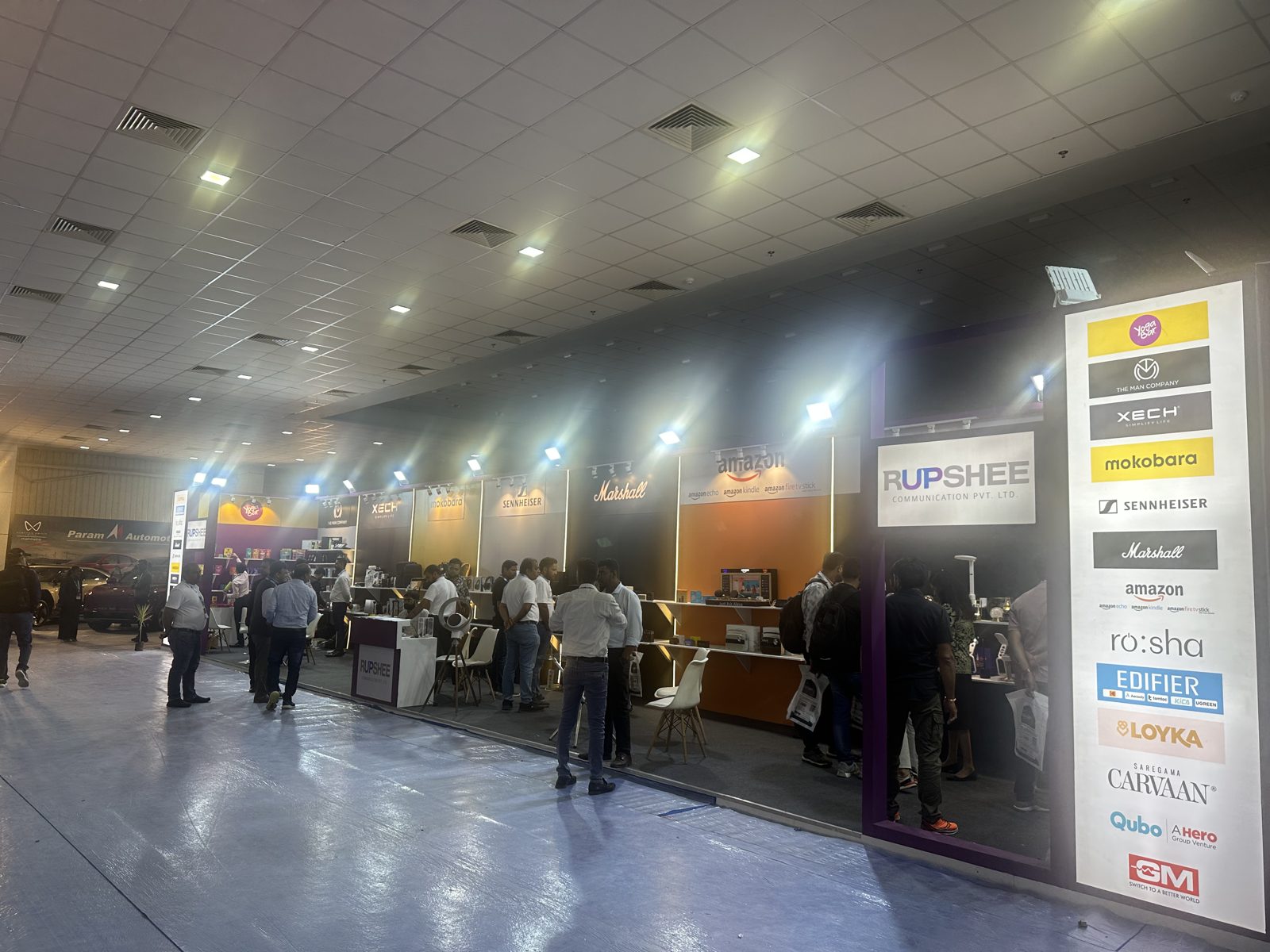 Rupshee stall from the other end, with brand bays and track lighting